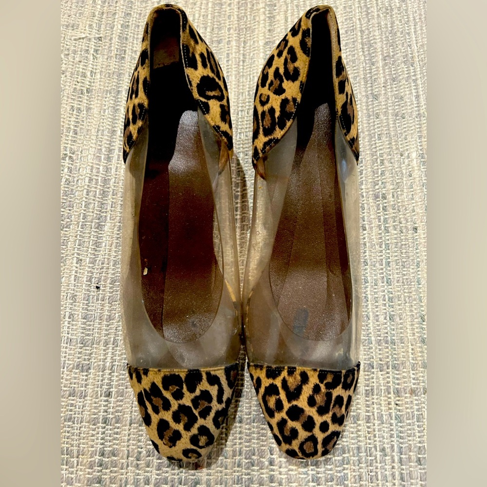 Plastic clear and leopard print low heeled pair of vintage shoes.